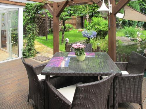 a black table and chairs on a patio at Holiday Home Heike by Interhome in Wandlitz