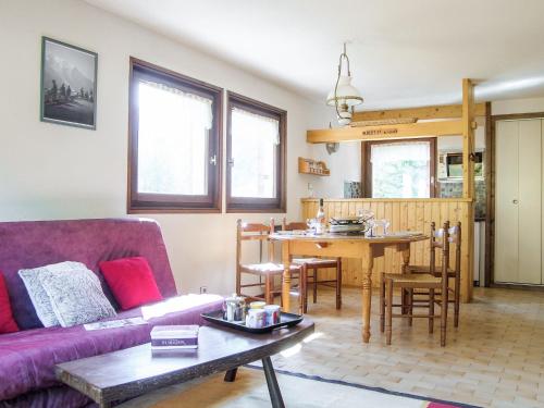 a living room with a couch and a table at Holiday Home Les Pelarnys by Interhome in Chamonix