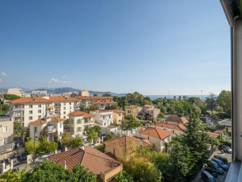 a view of a city with houses and cars at Apartment Plein Soleil by Interhome in Nice