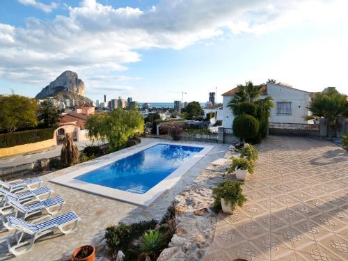 a pool on the roof of a house with a view at Holiday Home Jara by Interhome in Calpe
