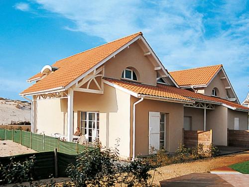 a white house with an orange roof at Holiday Home Résidence Dune Blanche - Océan1 - BPL321 by Interhome in Biscarrosse-Plage