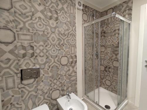 a bathroom with a shower and a sink at Apartment Federico by Interhome in Olgiasca