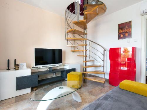 A television and/or entertainment centre at Apartment Renato - NOV115 by Interhome