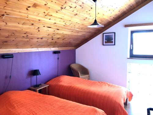 A bed or beds in a room at Holiday Home Au bord du Lac-1 by Interhome