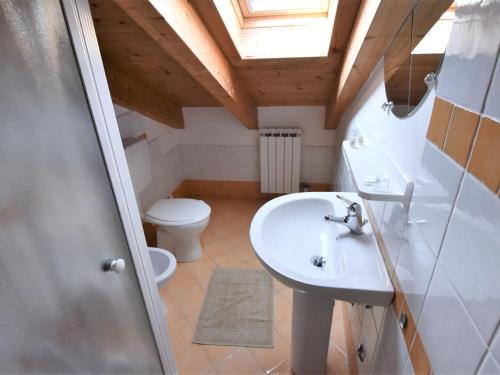 a bathroom with a sink and a toilet at Apartment Solmare-29 by Interhome in Rosapineta