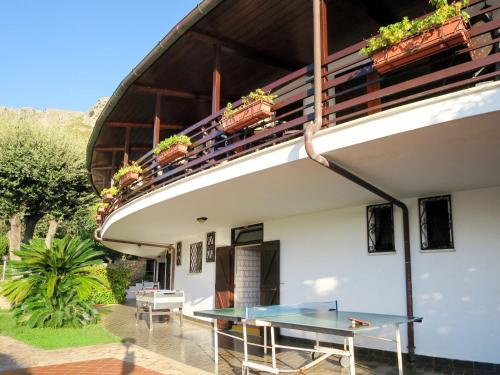 a ping pong table on the patio of a house at Apartment Costa di Kair ed Din-3 by Interhome in Sperlonga