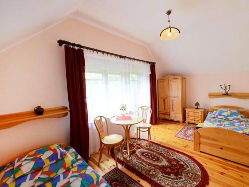 Postel nebo postele na pokoji v ubytování Holiday Home Dom pod Sosnami by Interhome