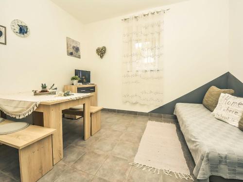 Televízia a/alebo spoločenská miestnosť v ubytovaní Apartment Snježana-2 by Interhome