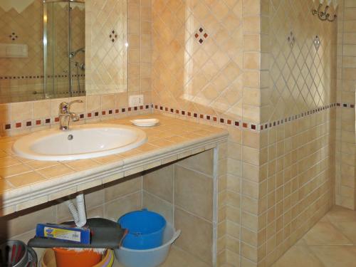 a bathroom with a sink and a mirror at Holiday Home Lia by Interhome in La Caletta