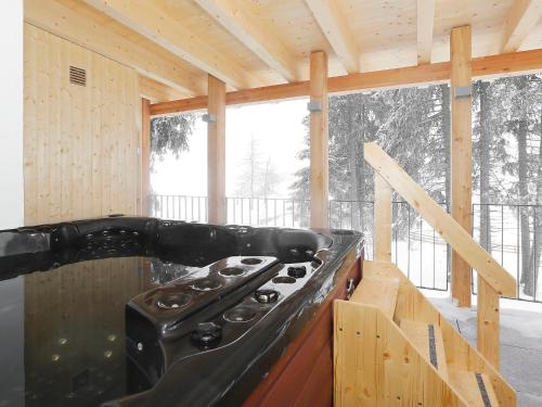 a kitchen with a stove in a house at Holiday Home von Capeller by Interhome in Parpan