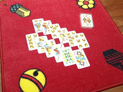 a red table with a bunch of playing cards on it at Holiday Home von Capeller by Interhome in Parpan