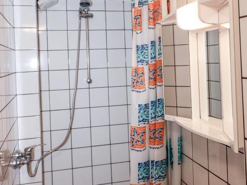 a shower in a bathroom with a shower curtain at Apartment Taubenschlag - Top 4 by Interhome in Grünau im Almtal