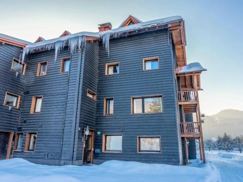 aominium building in the snow in the winter at Apartment Adlerhorst - Top 5 by Interhome in Grünau im Almtal