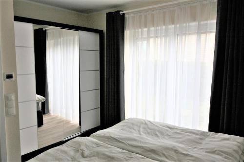 Cama ou camas em um quarto em Loreley Hills Residence