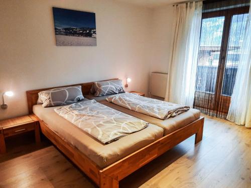 a bedroom with a large bed in a room at Apartment Anna by Interhome in Fügen