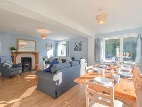 a living room with a couch and a table at Holiday Home Tigh na Sith by Interhome in Oban