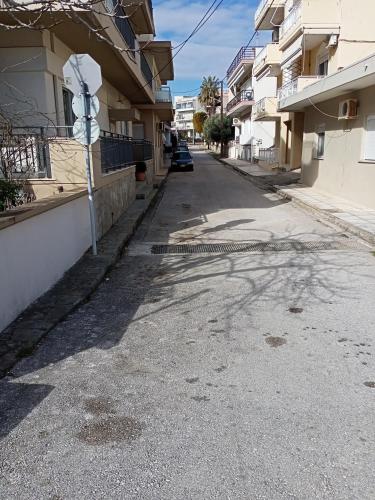 an empty street next to some apartment buildings at One Bedroom Flat 300m from Sea in Alexandroupoli