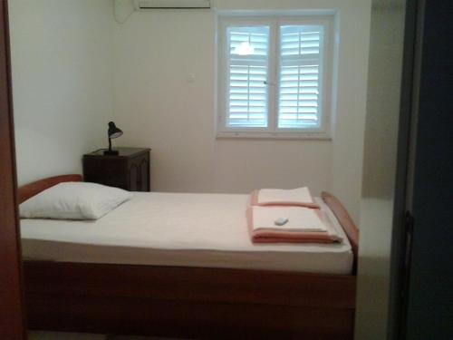 Cama o camas de una habitación en Apartment Ljilja