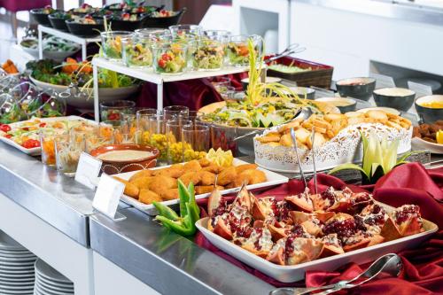 a buffet line with many different types of food at Interpass Vau Hotel Apartamentos in Portimão