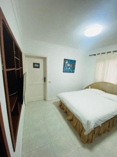a bedroom with a large bed in a room at Mision Costa in Corralejo