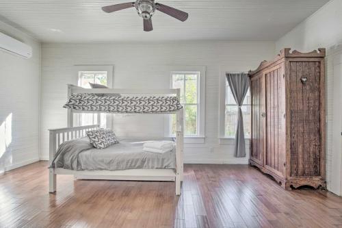 a bedroom with a bunk bed and a ceiling fan at Charming 100-Year-Old Home Less Than 1 Mi to Downtown in Ocala