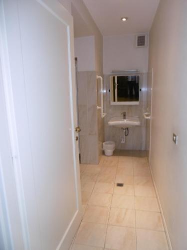 a bathroom with a toilet and a sink at Hotel Villa Maria in Sanremo