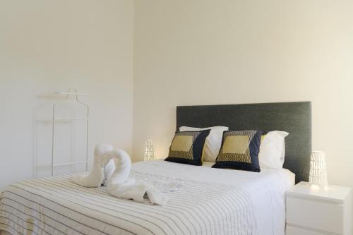 En eller flere senge i et værelse på Hopstays Vilamoura Aldeia do Golfe - House C3