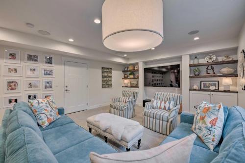 a living room with a blue couch and chairs at Vibrant Chic Home about 20 Mi to Salt Lake City! in Draper