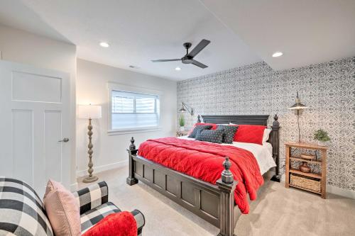 a bedroom with a red bed and a ceiling fan at Vibrant Chic Home about 20 Mi to Salt Lake City! in Draper