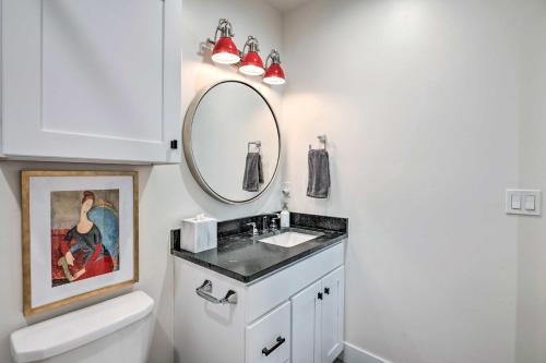 a bathroom with a sink and a mirror at Vibrant Chic Home about 20 Mi to Salt Lake City! in Draper