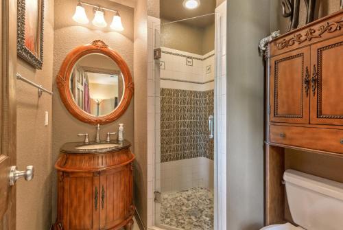 a bathroom with a sink and a shower with a mirror at The Funky Monkey Inn in Afton