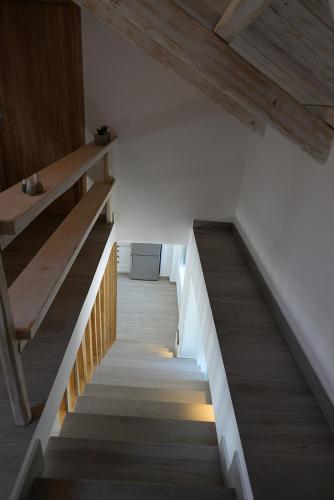 a staircase in a room with wooden floors and wooden ceilings at FAMILY in Spetses