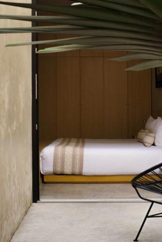 a bedroom with a bed in a room at Casa Carmen Reforma in Oaxaca City