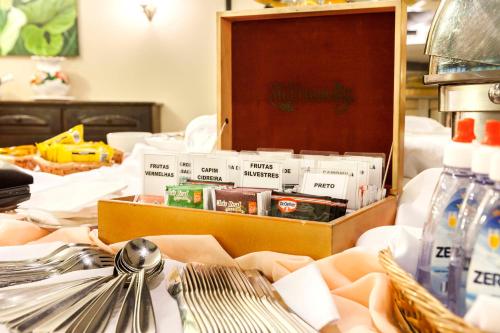 a box of food sitting on top of a bed at Hotel Tannenhof in Joinville
