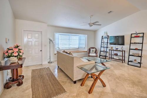 a living room with a couch and a table at Direct Gulf Access and Lanai Sunny Naples Home! in Naples