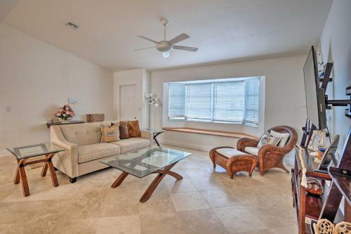 a living room with a couch and a table at Direct Gulf Access and Lanai Sunny Naples Home! in Naples