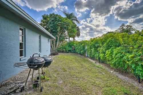 a bbq grill sitting outside of a house at Direct Gulf Access and Lanai Sunny Naples Home! in Naples