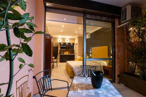 a room with a bed and a table and chairs at Domus Aurelia in Rome