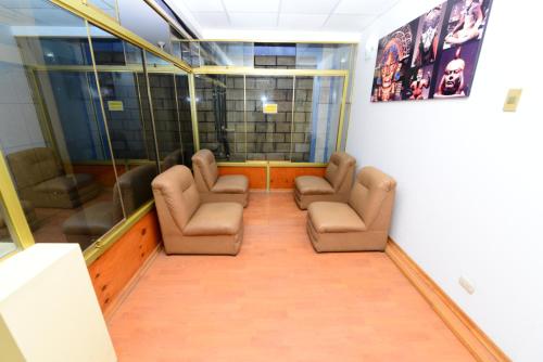 a waiting room with three chairs at Hotel Lucky Star in Chiclayo