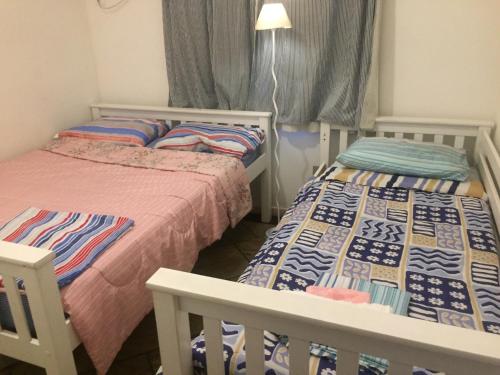Ein Bett oder Betten in einem Zimmer der Unterkunft A Casa - com 3 quartos e até 7 Hóspedes