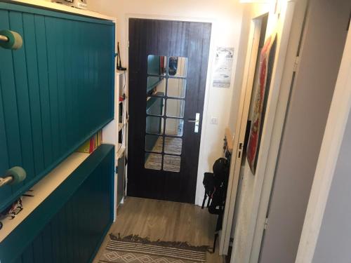 a hallway with a door leading into a room at Mon studio pour 4 à Val Claret ! in Tignes