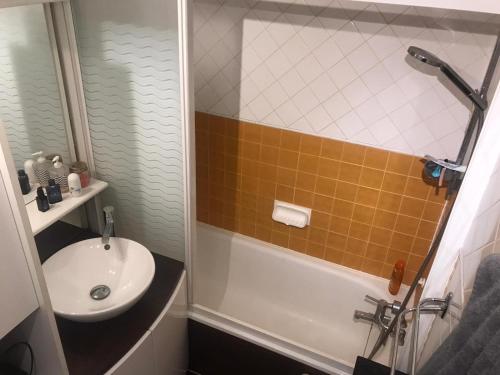 a bathroom with a sink and a toilet and a shower at Mon studio pour 4 à Val Claret ! in Tignes