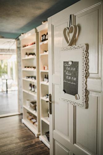 a door with a chalkboard with a heart on it at Penzion Adamův Dvůr in Masákova Lhota