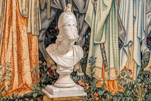 a statue sitting on a table in front of a curtain at Nakissa Inn in Rome