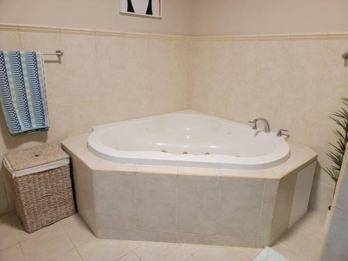 a large bath tub in a bathroom with at Private Beachfront House in Cabo Rojo