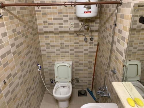 a small bathroom with a toilet and a sink at Kerotel Egypt in Cairo