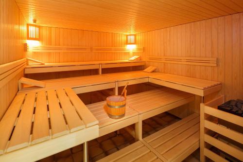 an empty sauna with a drink in the middle at Hotel Metropole Interlaken in Interlaken