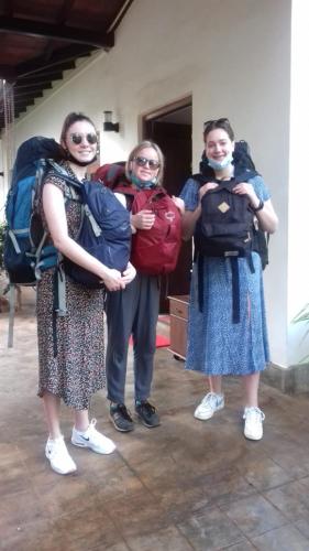 a group of three people with backpacks on their backs at Villa DeLorenta in Anuradhapura