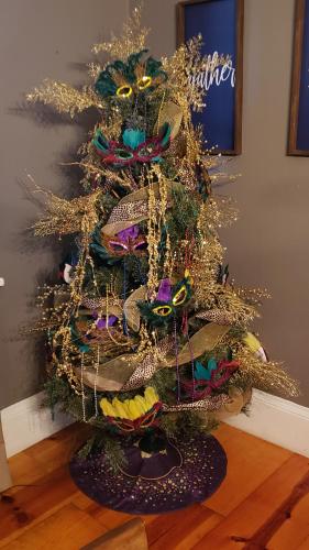 a christmas tree with hats on top of it at The Lafayette House in Mobile