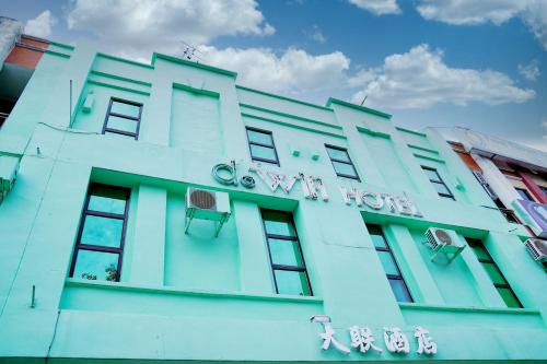 a blue building with a sign on it at Dowifi Hotel in Sungai Petani